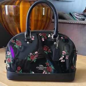 Coach black patent leather bag with floral print